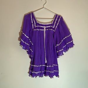 Pretty purple women’s top with white satin ribbon.